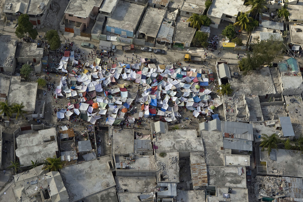 Haitians set up impromtu tent cities thorough the capital after an earthquake measuring 7 plus on the Richter scale rocked Port au Prince Haiti just before 5 pm yesterday, January 12, 2009.